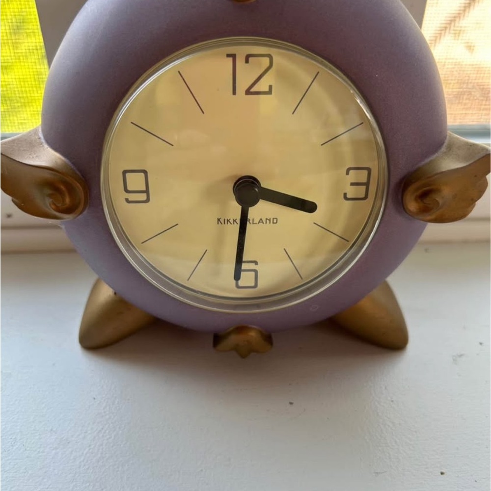 $60 
Vintage Purple and Gold Winged Kikkerland Clock by Timestone.